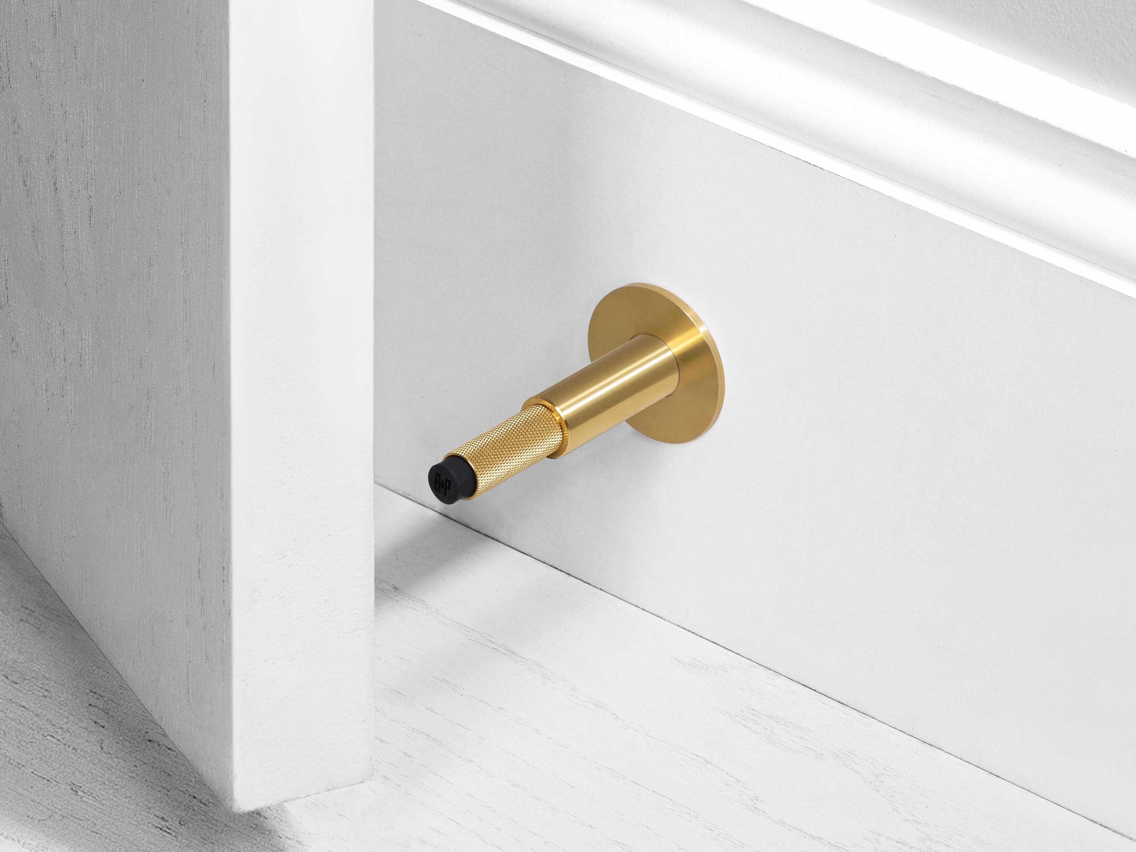 Buster + Punch Brass Wall Door Stop