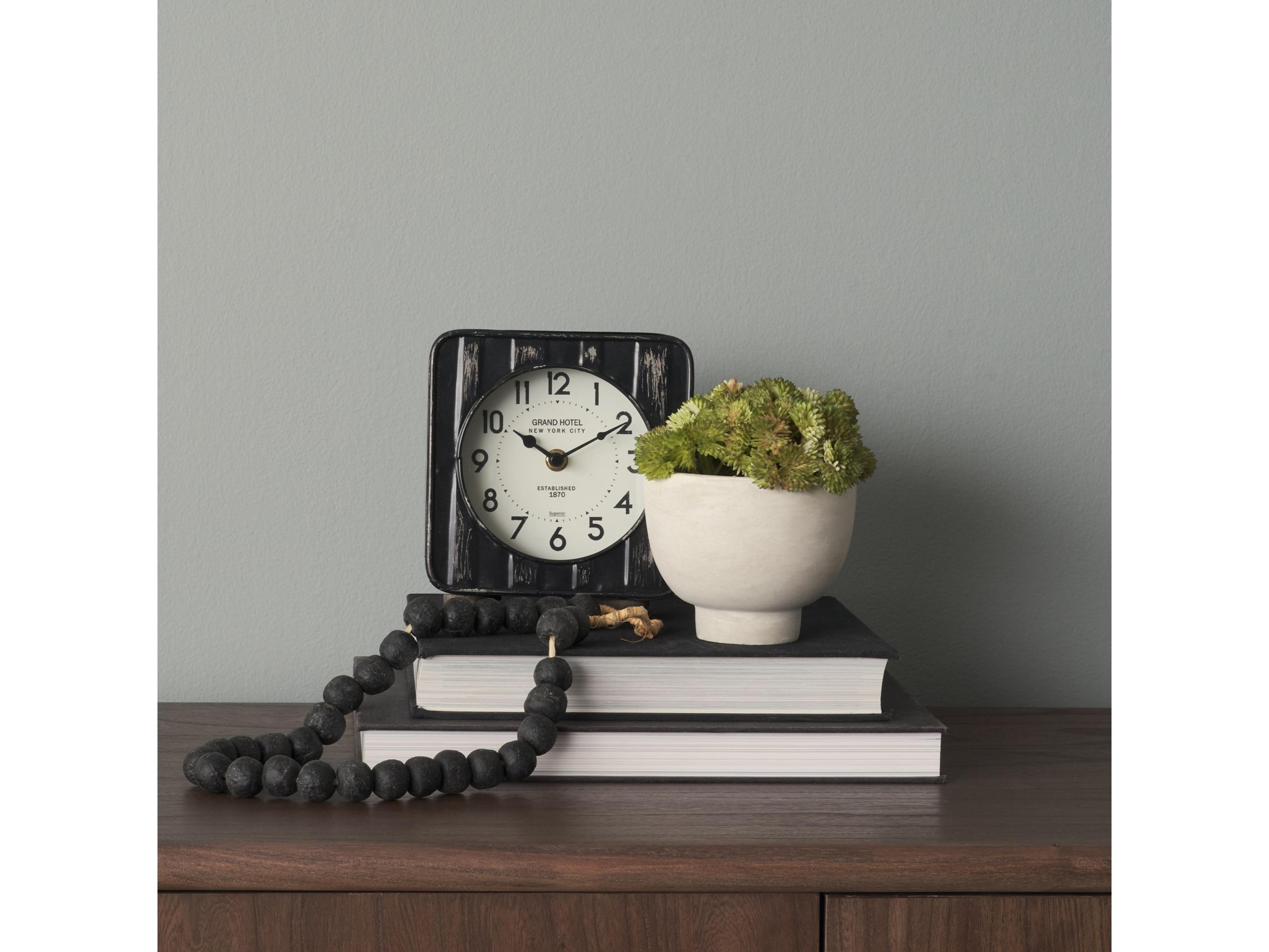 Mercana Karl 6.0L x 3.0W x 6.8H Rustic Black Iron Rounded Square Table Clock