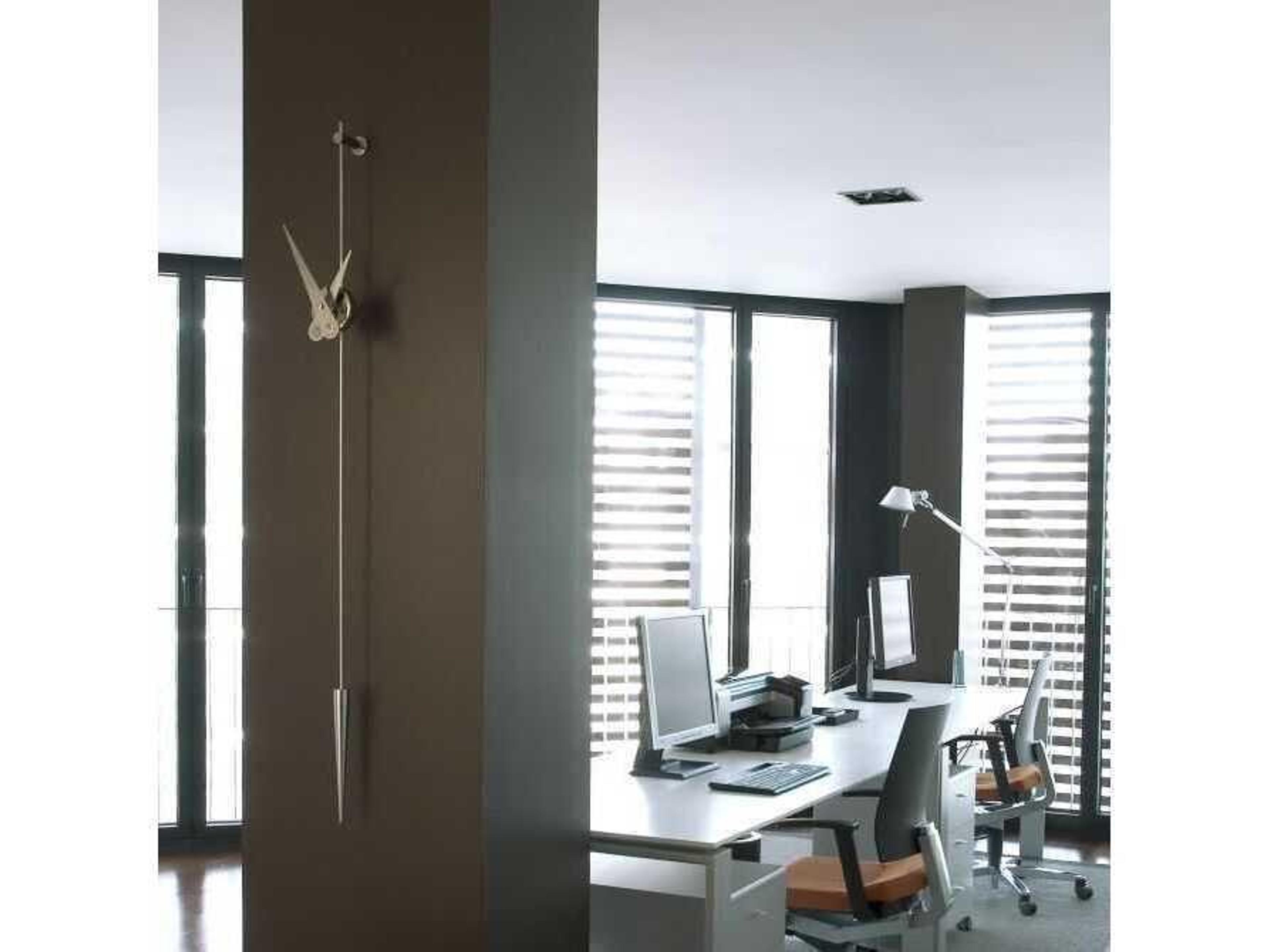 Nomon Punto Y Coma Chrome Wall Clock