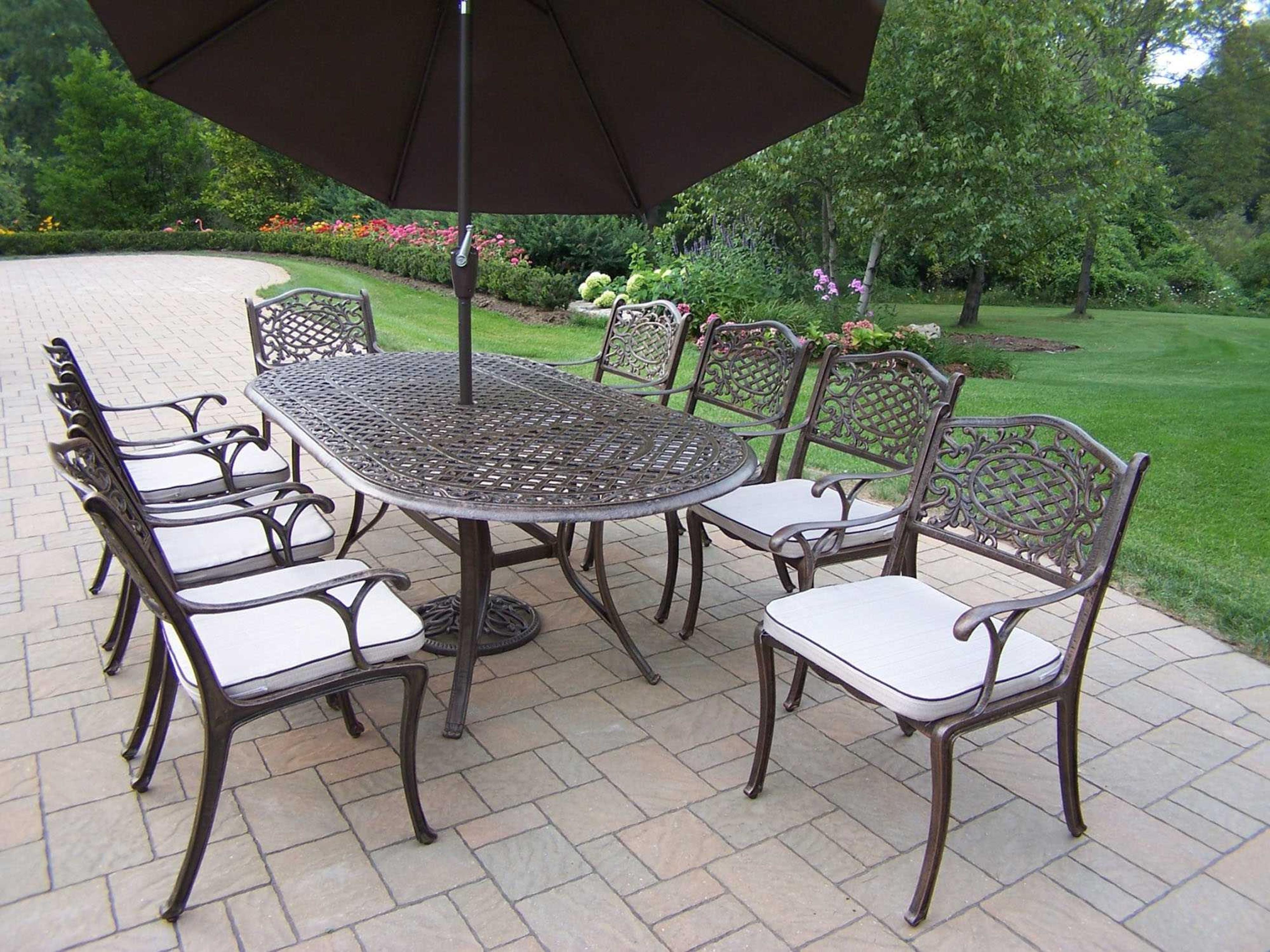 Oakland Living Mississippi Casual Cushion with Umbrella and Stand Cast Aluminum Patio Dining Set