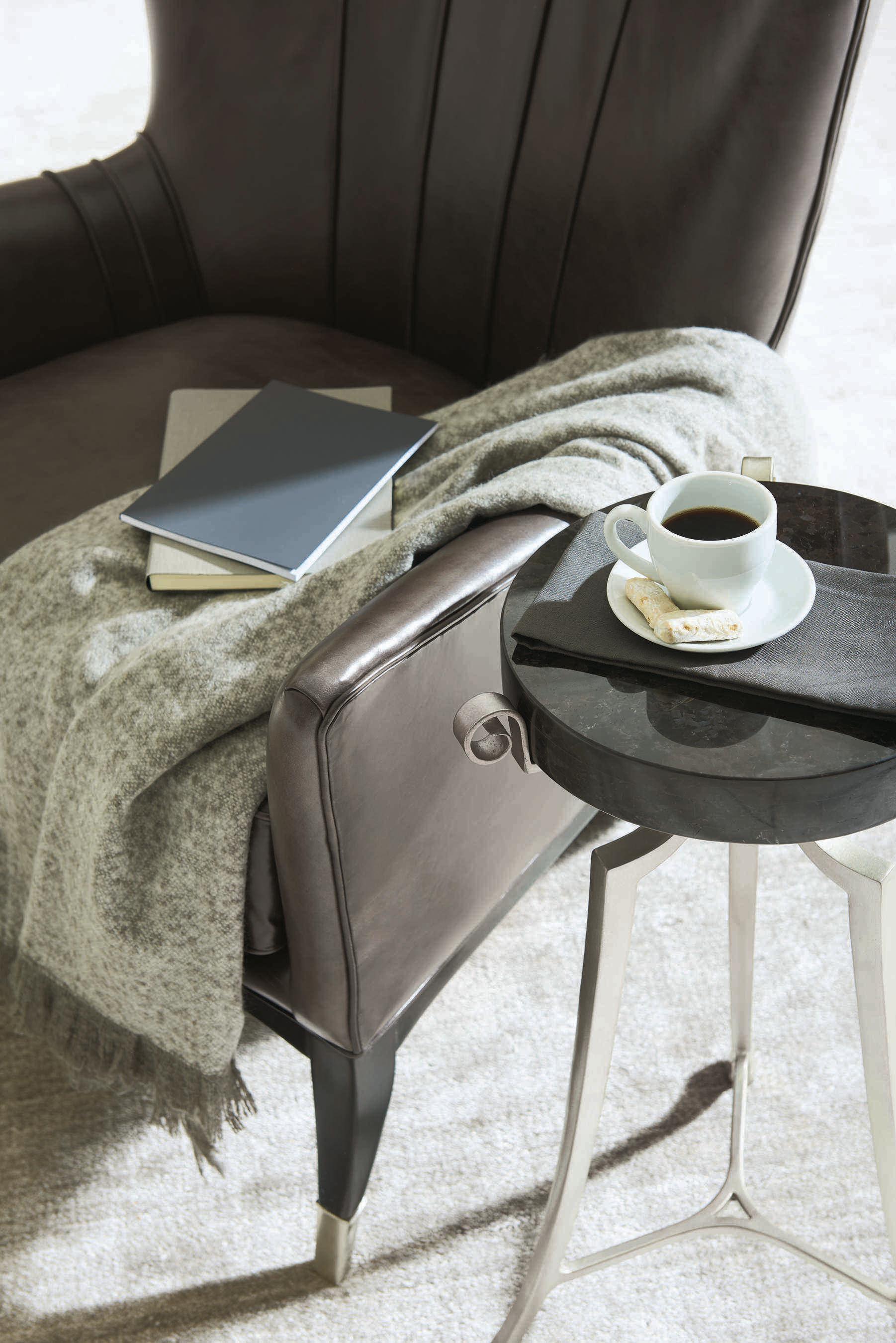 Caracole Upholstery So Welt Done Wingback Black Leather Accent Chair with Metal Ferrules