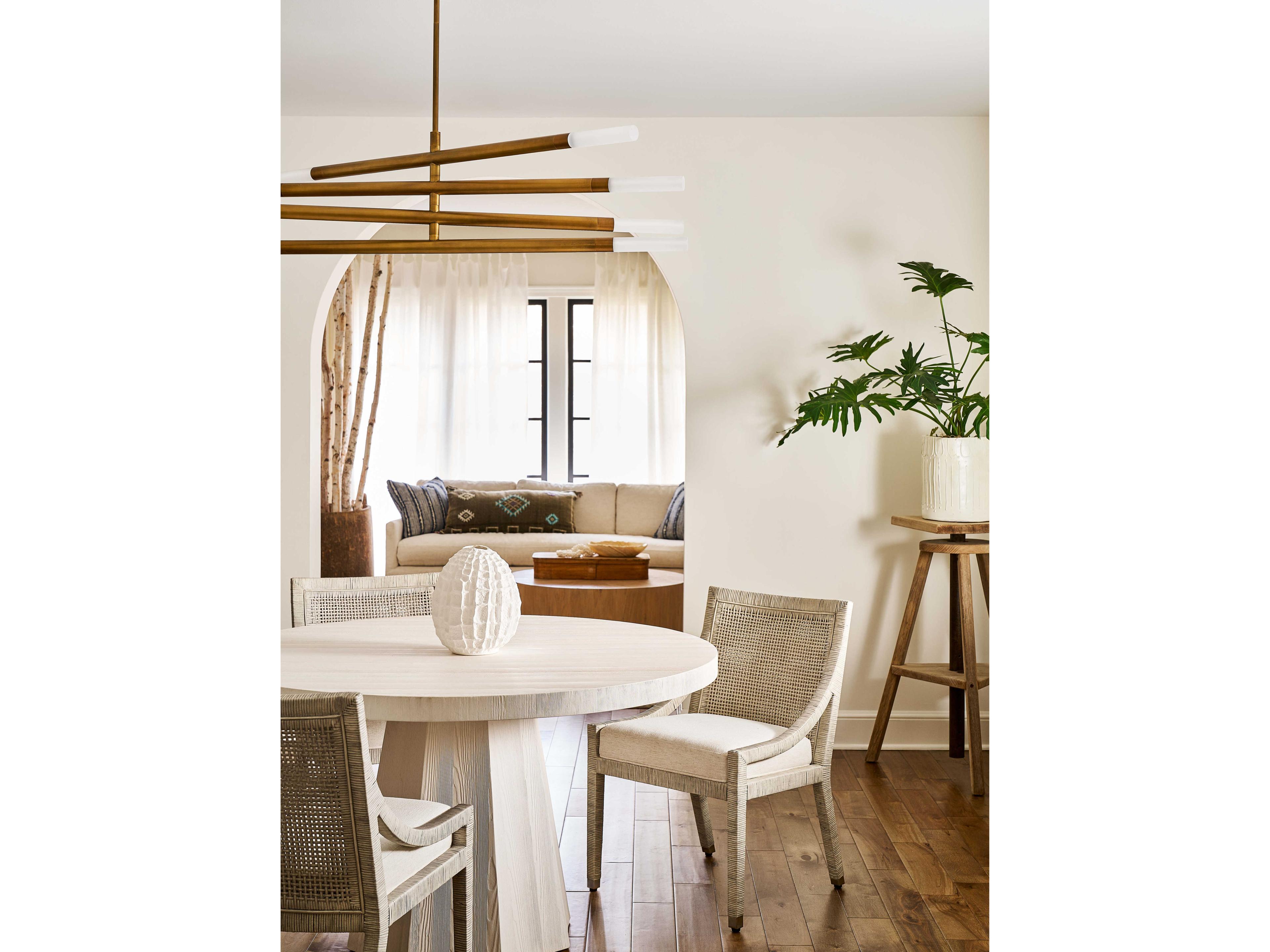 Coastal Living Home Weekender Rattan White Upholstered Arm Dining Chair