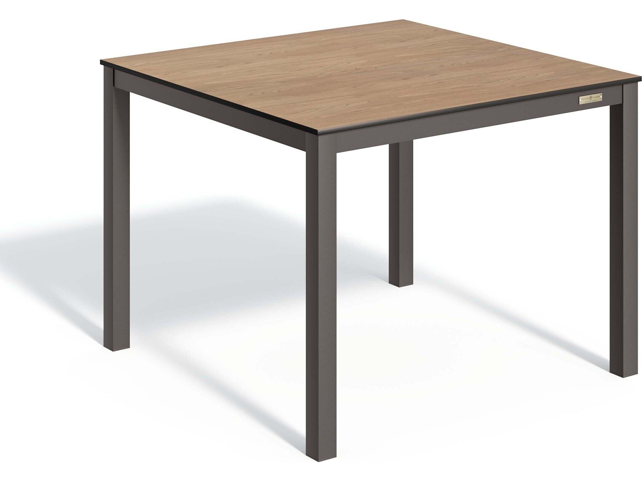 Oxford Garden Travira Aluminum Carbon Square HPL Top Patio Dining Table with Umbrella Hole