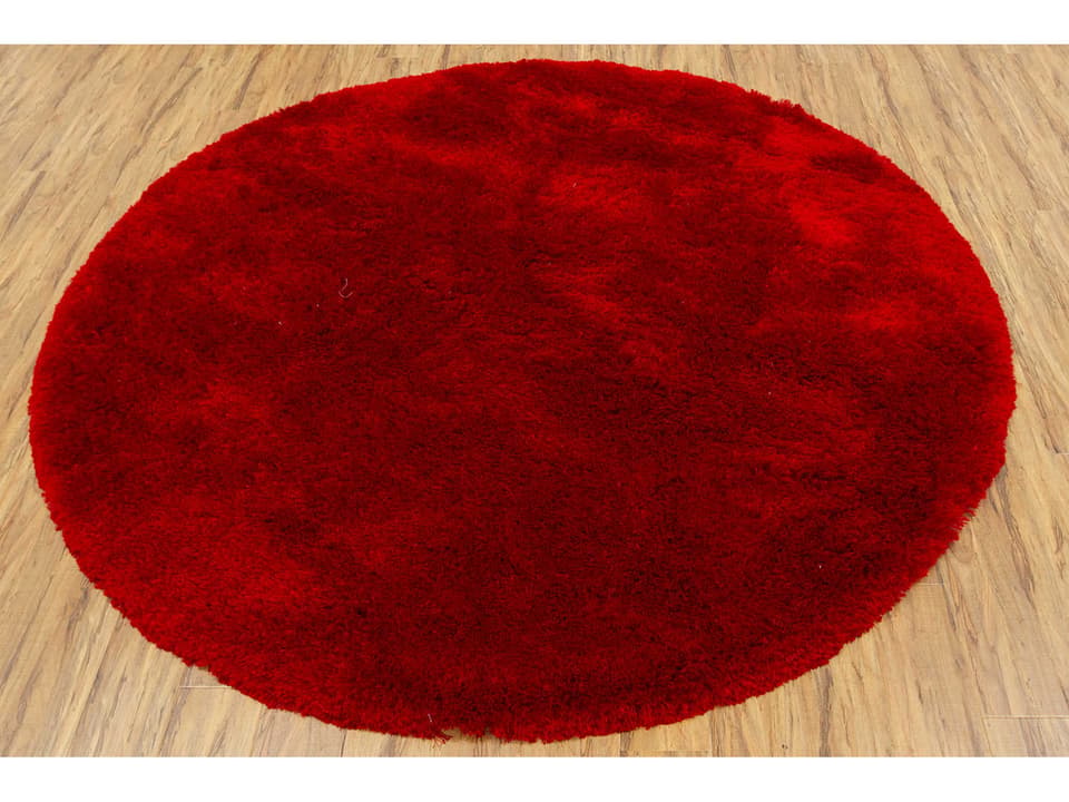 Naya 93-Inch Round Hand-Woven Polyester Shag Area Rug in Red