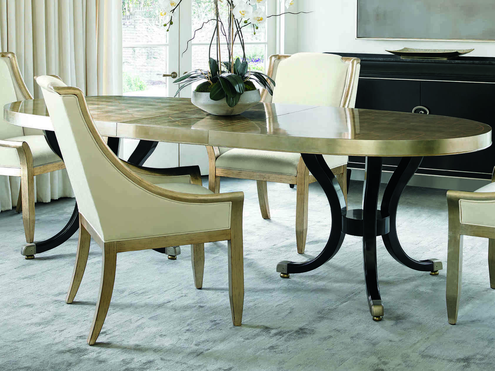 Caracole Classic Taupe Silver Leaf With Gold Satin Ebony 82 120 W X 42 D Oval Dining Table With Extension Caccla015206