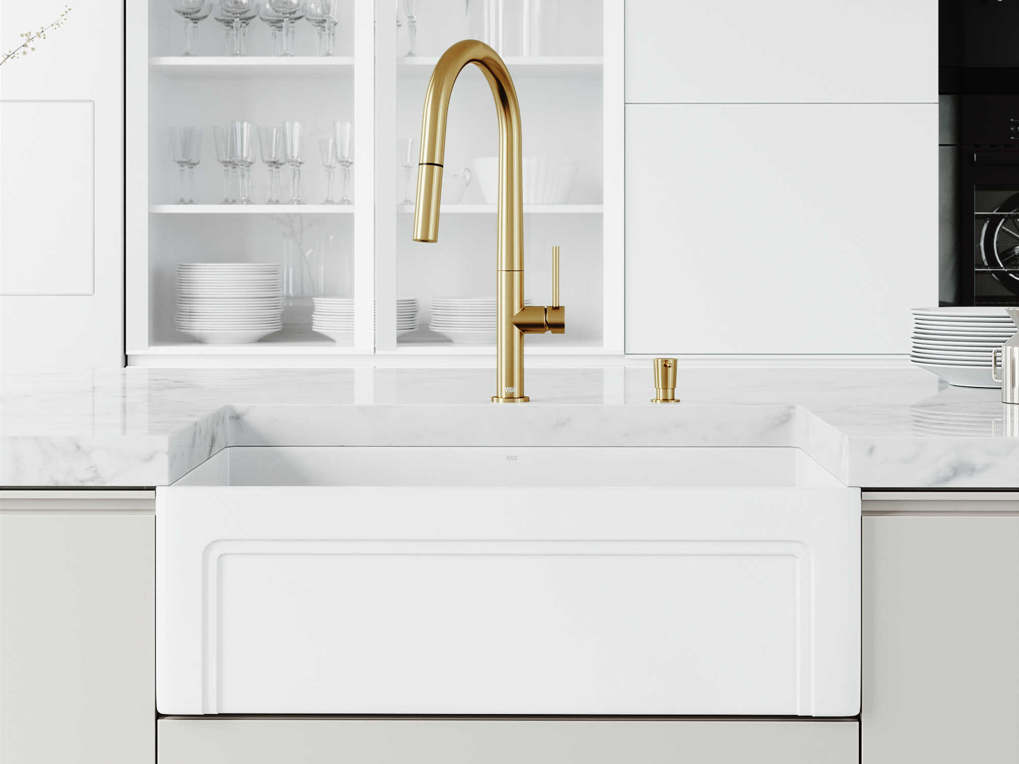 white kitchen sink with gold faucet